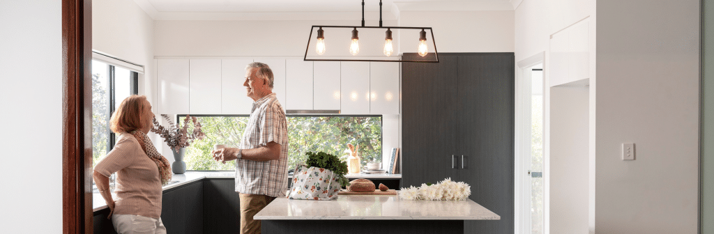 Mature couple in TR Homes' Hamelin Bay home kitchen