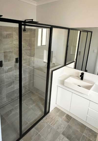 Bathroom with black tapware and black shower frames